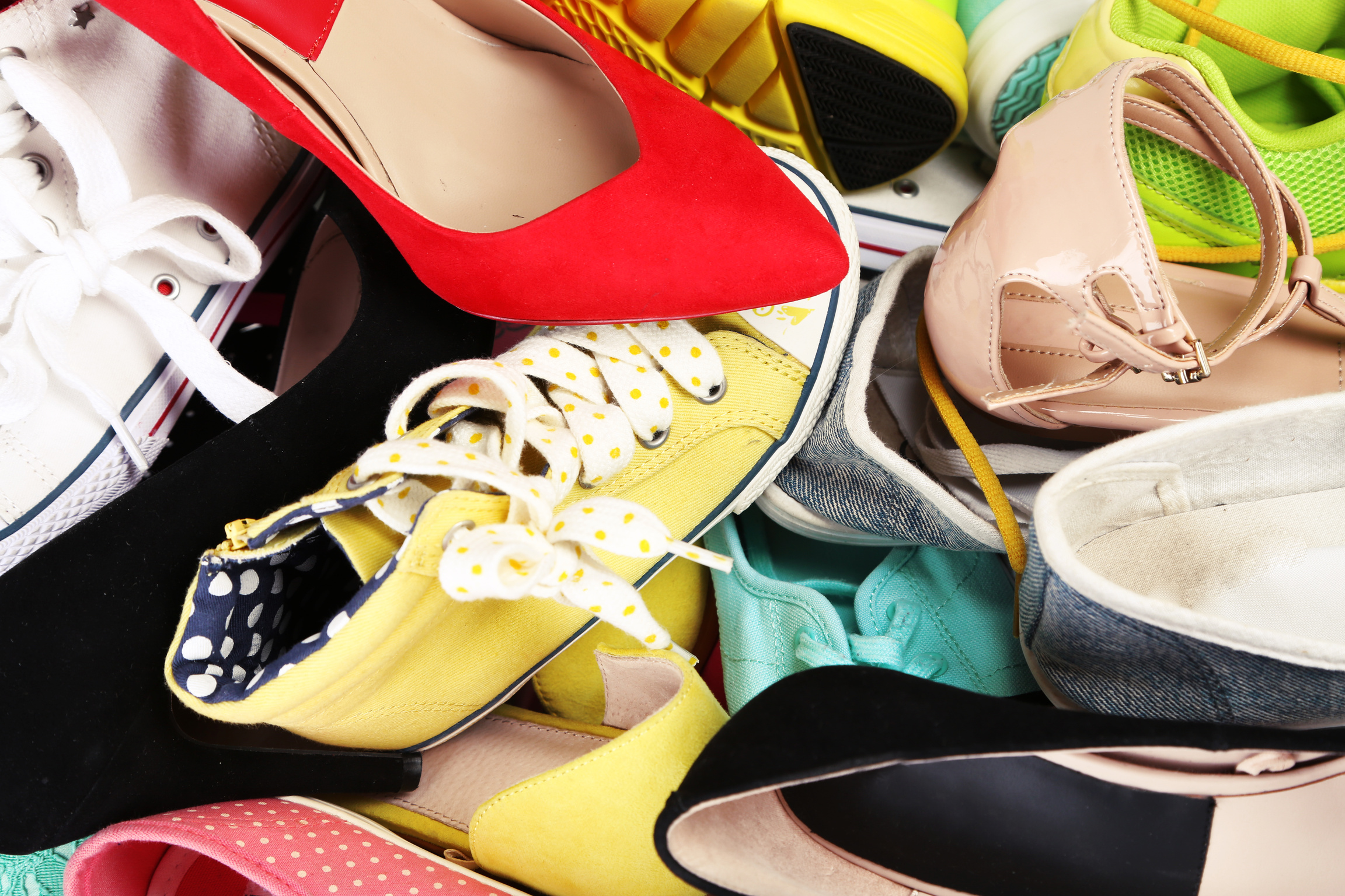 Pile of Assorted Female Shoes Background 